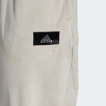 ADIDAS SPORTSWEARTapered Sportske hlače 'Holidayz Cozy Velour' - bež boja
