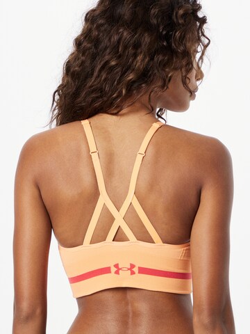 Bustino Reggiseno sportivo di UNDER ARMOUR in arancione