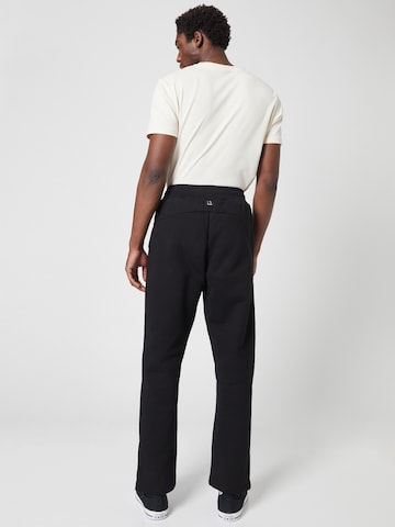 ABOUT YOU x Louis Darcis Loose fit Pants in Black