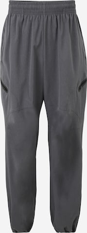 UNDER ARMOUR - Tapered Pantalón deportivo 'Unstoppable' en gris: frente