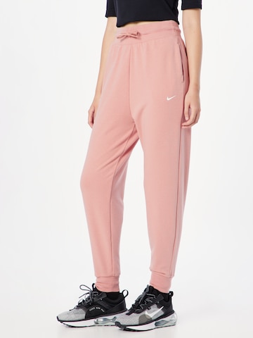NIKE Tapered Sports trousers in Red: front