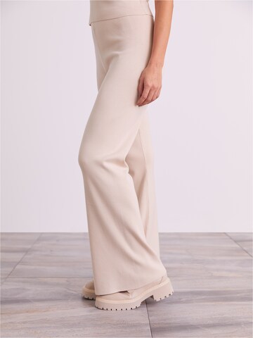ABOUT YOU x Iconic by Tatiana Kucharova Wide leg Trousers 'Milena' in Beige