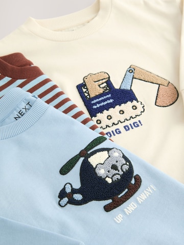 Tricou de la Next pe bej