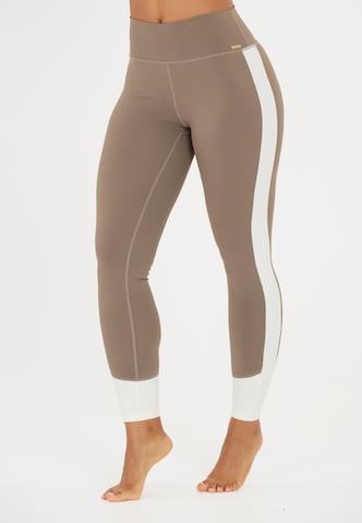 Athlecia Skinny Sports trousers 'Lris' in Brown: front