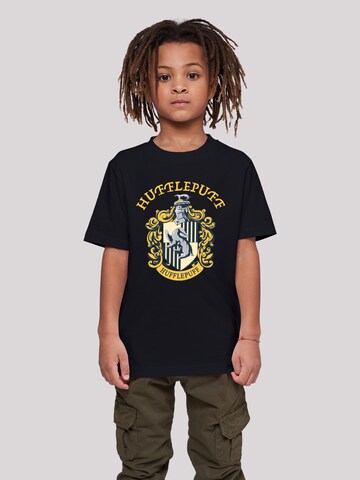 F4NT4STIC Shirt 'Harry Potter Hufflepuff Crest' in Zwart: voorkant