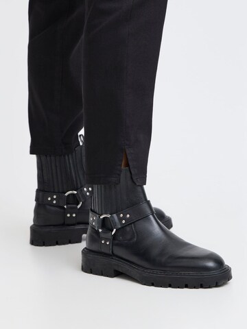 Skinny Pantaloni chino di PULZ Jeans in nero