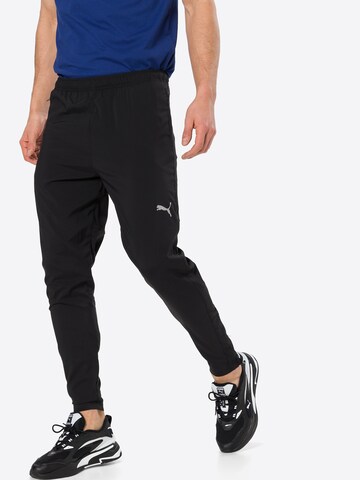 PUMA Конический (Tapered) Спортивные штаны в Черный: спереди
