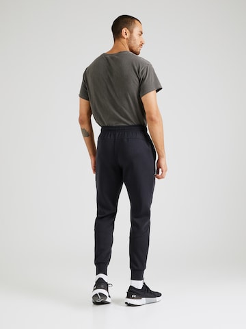 Effilé Pantalon de sport 'Unstoppable' UNDER ARMOUR en noir