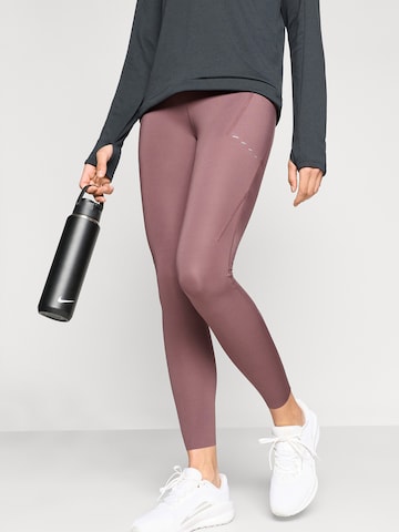 NIKE Skinny Športové nohavice 'SWIFT' - Fialová