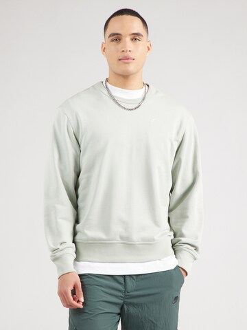 Champion Authentic Athletic Apparel Sweatshirt i grön: framsida