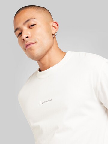 Calvin Klein Jeans Tričko 'CITY GRID MAP' – bílá