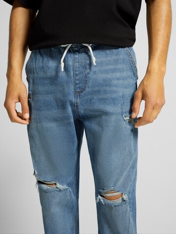 Bershka Tapered Jeans i blå