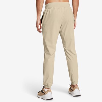 UNDER ARMOUR Tapered Workout Pants in Beige