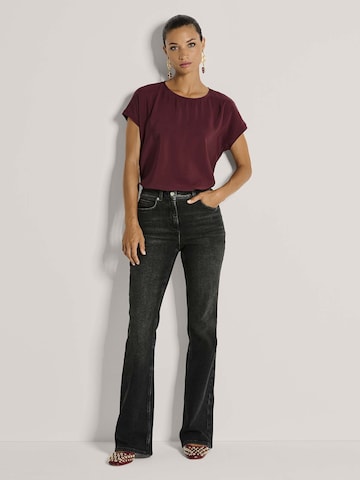 MADELEINE Bootcut Jeans in Schwarz