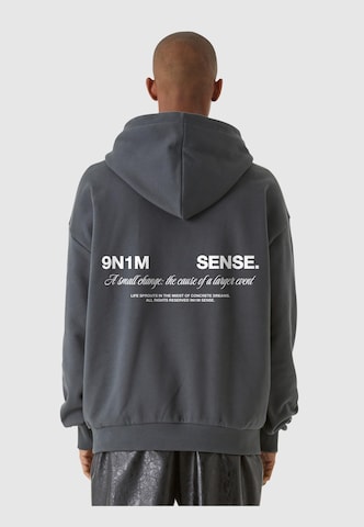 9N1M SENSE Sweatshirt 'Change' in Grijs: voorkant