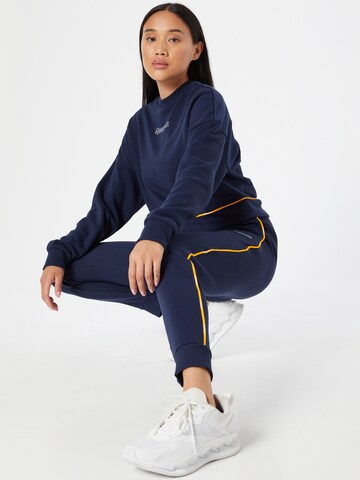 Effilé Pantalon de sport Reebok en bleu