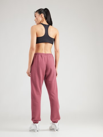Tapered Pantaloni 'Studio Fleece' de la Nike Sportswear pe roz