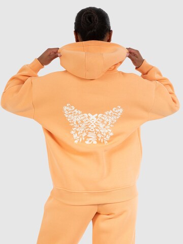 Veste de survêtement ' Nala ' Smilodox en orange