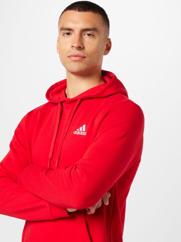 ADIDAS SPORTSWEAR Αθλητική μπλούζα φούτερ 'Essentials' σε κόκκινο