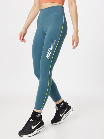 NIKE Skinny Workout Pants in Green: front