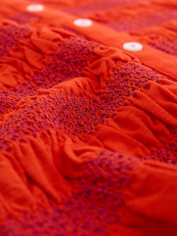 Haut Next en rouge