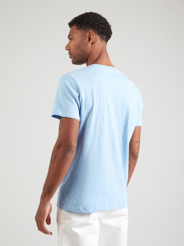 Tricou de la La Martina pe albastru: spate