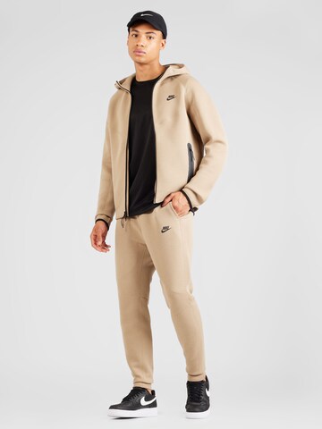 Nike Sportswear Zwężany krój Spodnie 'Tech Fleece' w kolorze beżowy