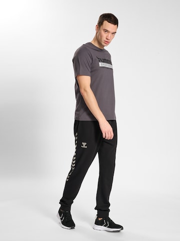 Hummel Ozke Športne hlače 'Staltic' | črna barva
