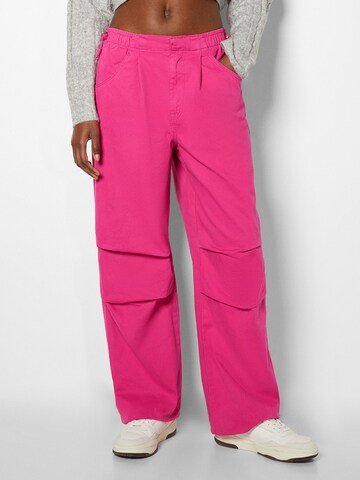 Bershka Wide leg Pleat-Front Pants in Pink: front
