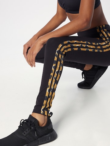 ADIDAS SPORTSWEAR Skinny Sportbroek 'Essentials 3-Stripes Animal Print' in Zwart