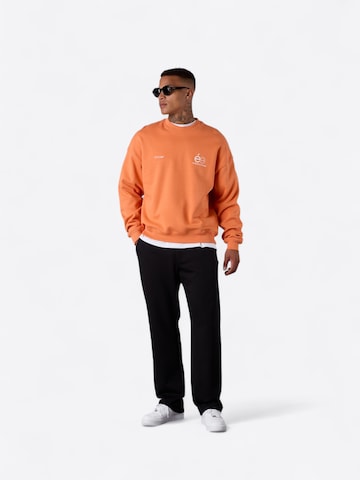 ESTEEM Sweatshirt 'Opposé' in Orange