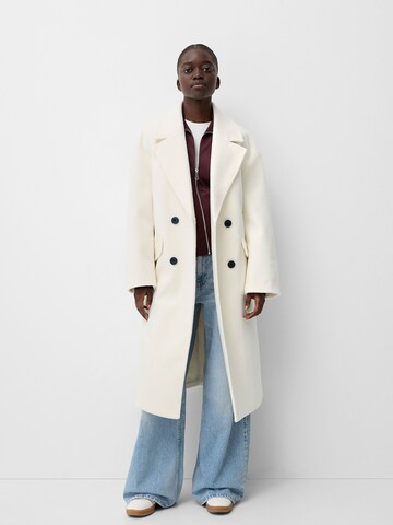 Bershka Between-seasons coat in Beige: front