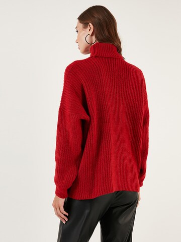 Pullover di LELA in rosso