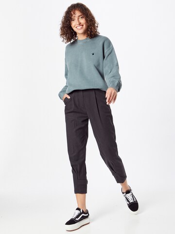 Tapered Pantaloni cutați de la Sisley pe negru