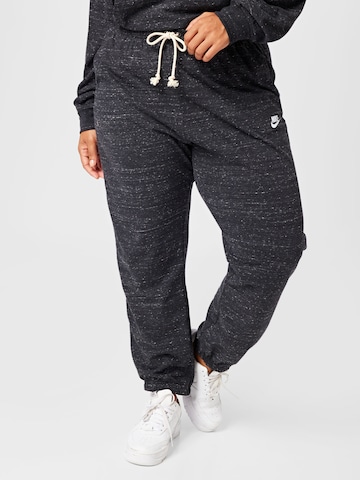 Nike Sportswear Tapered Trousers in Black: front