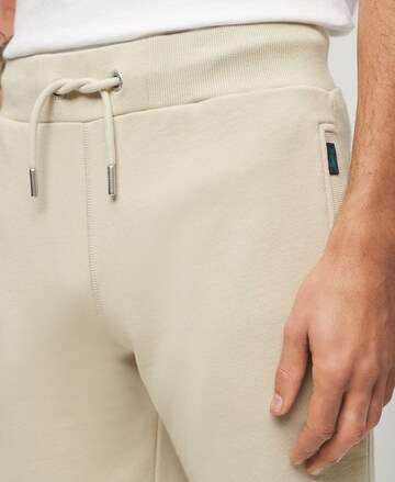 Superdry Tapered Pants 'Essential' in Beige
