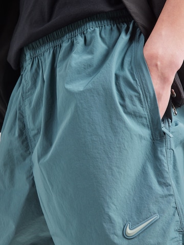 Nike Sportswear Ohlapna forma Hlače 'NOCTA' | zelena barva