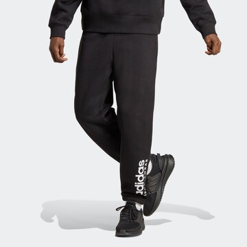ADIDAS SPORTSWEAR Tapered Workout Pants in Black: front