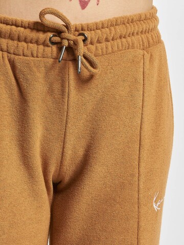 Karl Kani Loose fit Pants in Brown