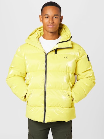 Calvin Klein JeansPrijelazna jakna - žuta boja: prednji dio