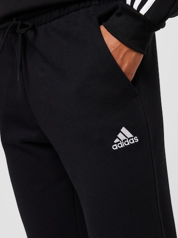 ADIDAS SPORTSWEAR Tapered Sports trousers 'Essentials' in Black