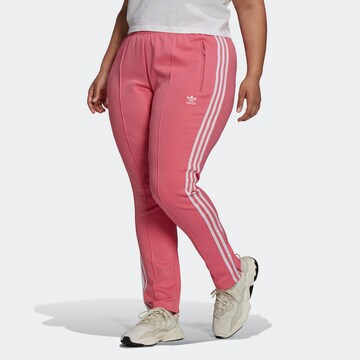 Slimfit Pantaloni de la ADIDAS ORIGINALS pe roz: față