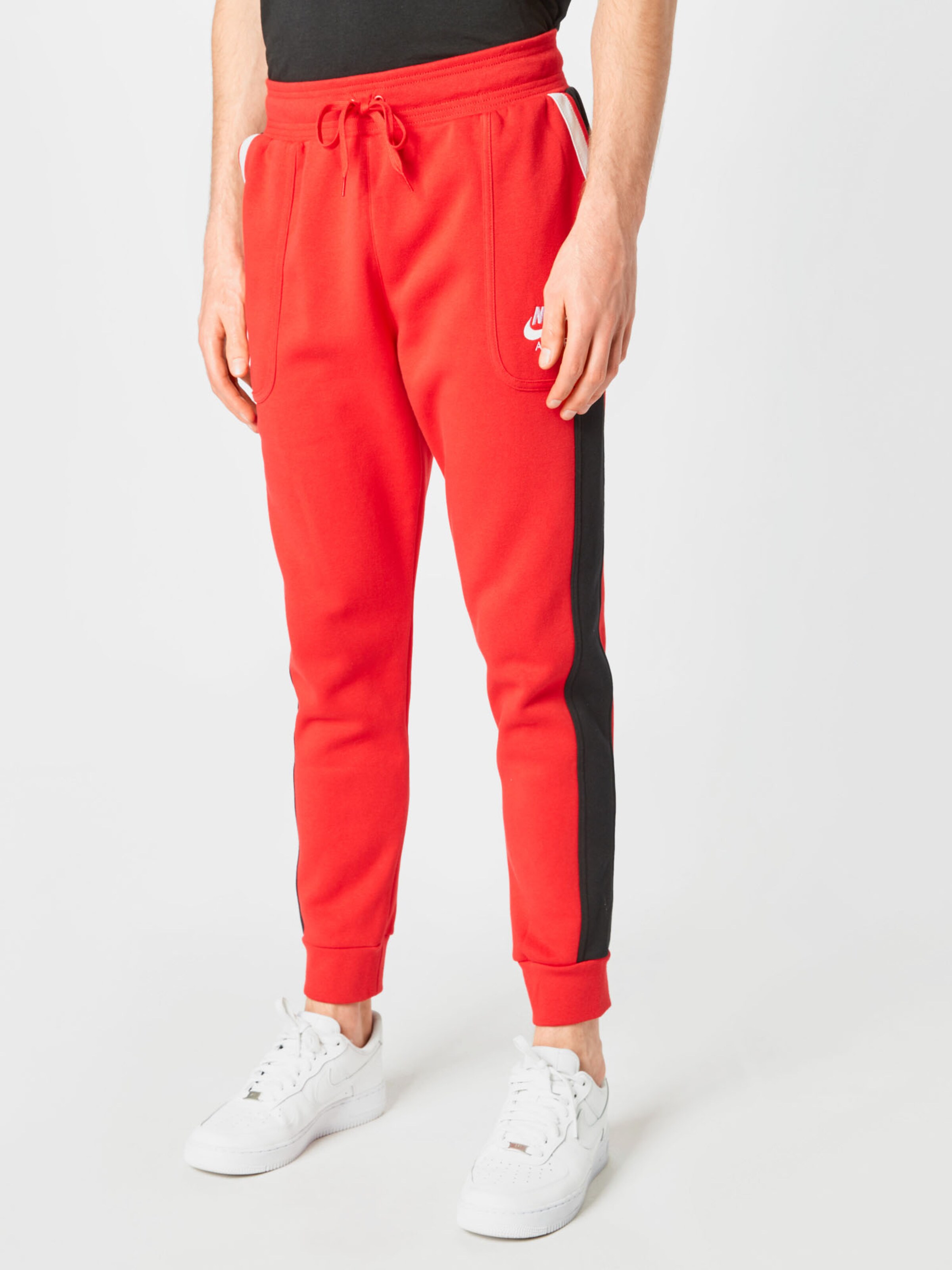 Effile Pantalon Nike Sportswear en Rouge Orange ABOUT YOU