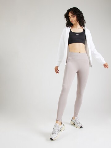 UNDER ARMOUR Skinny Spodnie sportowe w kolorze szary