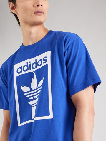 ADIDAS ORIGINALSMajica 'Trefoil Torch' - plava boja