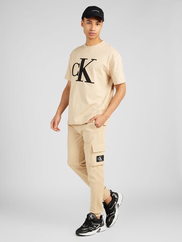 Tapered Pantaloni cargo di Calvin Klein Jeans in beige