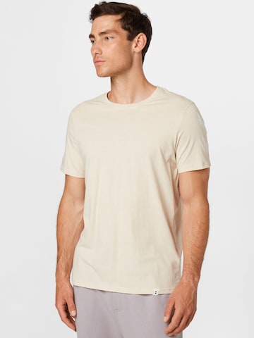 T-Shirt fonctionnel 'Legacy' Hummel en beige : devant