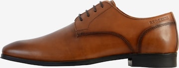 Chaussure basse REDSKINS en marron : devant