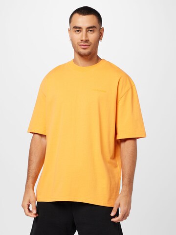 Pegador Tričko – oranžová: přední strana