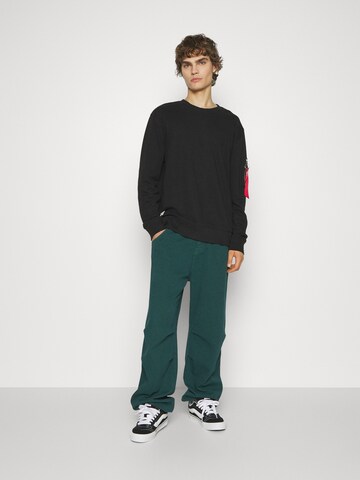 ALPHA INDUSTRIES Sweatshirt in Schwarz